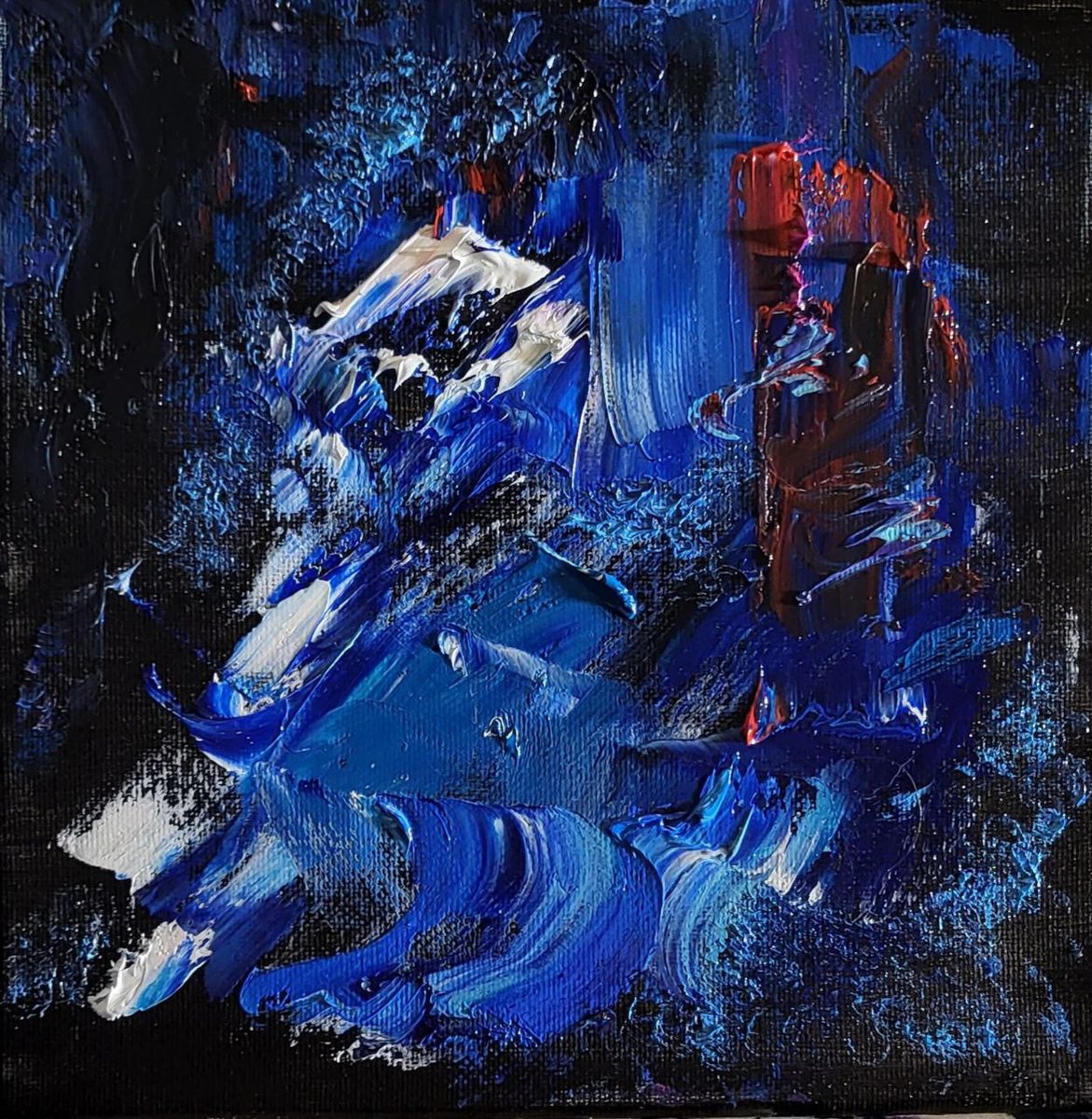 Ultramarine and cobalt impasto holding a single ember of rust red